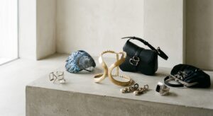 High-end editorial fashion photography featuring a curated collection of iconic, avant-garde accesso