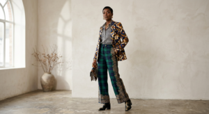 A professional editorial fashion shot of a stylish person confidently wearing a sophisticated ensemb